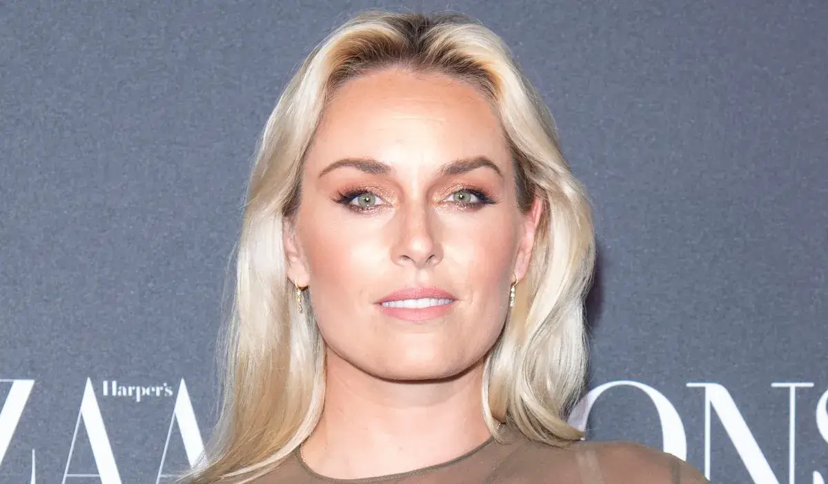 Lindsey Vonn in Orange Leggings Lifts Weights and Works Out